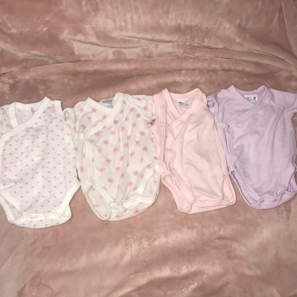 4 0-3 onesies for a baby girl